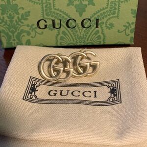 NWOT Gorgeous Gold-plated GUCCI Logo Earrings.